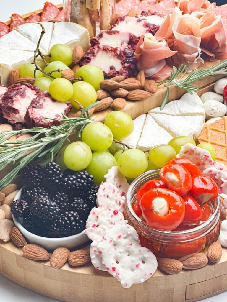 close up of meat and cheeses in a charcuterie board